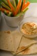 hummus dip with pita bread and vegetable
