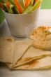 hummus dip with pita bread and vegetable
