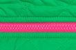pink zipper on the green fabric