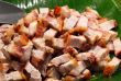 Roast pork cut into pieces on palm leaf