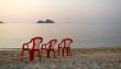 Empty beach three chair `watching` ; the sunset