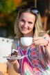 girl with a cup of coffee and cake