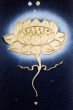 golden flower painted on a dark canvas