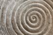 relief pattern on a stone in the form of a spiral