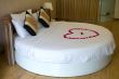 Honeymoon bed topped with rose petals