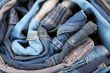stack of various jeans