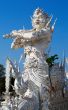 sculpture soldier guards the entrance to the white temple in Chi