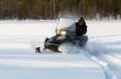 man riding a snowmobile