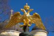 golden double-headed eagle on a background of blue sky