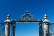 The gate and fence on a blue sky background