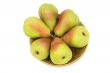 Ripe pears on the plate on a white background.