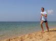 Man running against the sea