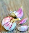 red garlic bulb on old wood