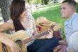 Mixed Race Couple at the Park Playing Guitar and Singing