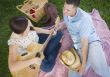 Mixed Race Couple at the Park Playing Guitar and Singing