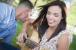 Mixed Race Couple at the Park Playing Guitar and Singing
