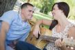 Mixed Race Couple at the Park Playing Guitar and Singing