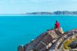 man sitting on a rock