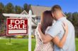 For Sale Real Estate Sign, Military Couple Looking at House