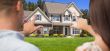 House and Military Couple Framing Hands in Front