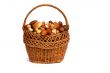 Mushrooms in a wicker basket on a white background.