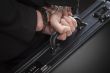 Woman In Handcuffs Carrying Briefcase