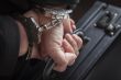 Woman In Handcuffs Carrying Briefcase