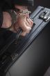 Woman In Handcuffs Carrying Briefcase