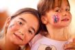 Cute Girls Showing Their Face Painting At A Party
