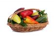 Red, yellow and green pepper in a basket on a white background.