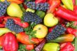 A lot of various fruits, red , yellow and green pepper.