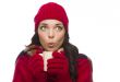 Mixed Race Woman Wearing Mittens Holds Mug Looks to Side