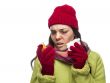 Sick Mixed Race Woman with Empty Medicine Bottles Blowing Nose 