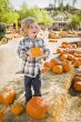 Little Boy Holding His Pumpkin at a Pumpkin Patch
