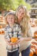 Attractive Mother and Son Portrait at the Pumpkin Patch