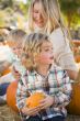 Young Family Enjoys a Day at the Pumpkin Patch