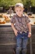 Little Boy With Hands in His Pockets at Pumpkin Patch