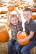 Two Boys at the Pumpkin Patch Talking and Having Fun