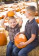 Two Boys at the Pumpkin Patch Talking and Having Fun