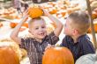 Two Boys at the Pumpkin Patch Talking and Having Fun