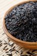 Wooden bowl full of wild rice