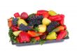 Fruits , pepper and parsley leaves on a plate on a white backgro