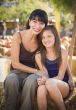 Attractive Mother and Daughter Portrait at the Pumpkin Patch