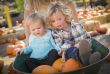 Young Family Enjoys a Day at the Pumpkin Patch