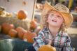 Little Boy in Cowboy Hat at Pumpkin Patch
