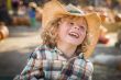 Little Boy in Cowboy Hat at Pumpkin Patch