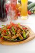 original fajita sizzling hot  on iron plate