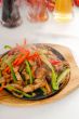original fajita sizzling hot  on iron plate
