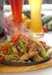 original fajita sizzling hot  on iron plate