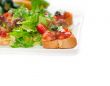 original Italian fresh bruschetta served with fresh salad and ve
